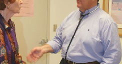 SHREVEPORT, LA - MARCH 19: President of the American Academy of Family Physicians, Dr. Michael Fleming, who considers himself "obese", at 6 ft, 260 lbs, speaks with his patient Wanda Patrick, March 19, 2004, in Shreveport, LA. Fleming, whose goal is to lose 30 pounds during his yearlong tenure, is spearheading a program among the academy's doctors to lose weight and he charts the progress of his personal exercise and diet program on his office computer. (Photo by Mario Villafuerte/Getty Images) *** Local Caption *** Dr. Michael Fleming